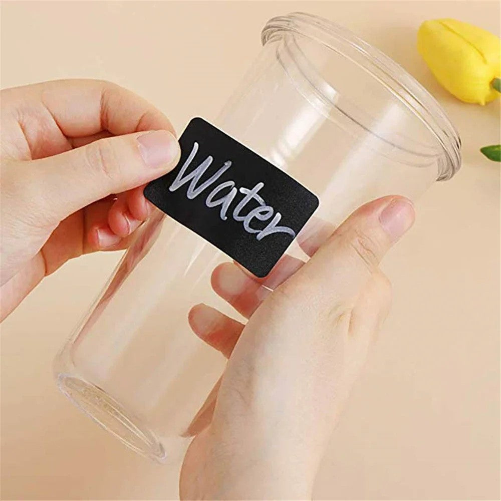 Reusable chalkboard label applied on transparent cup labeled “Water”
