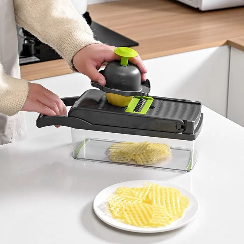 User slicing potatoes with safety holder and crinkle blade on vegetable slicer
