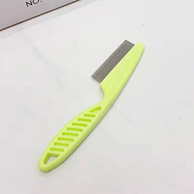 Green pet facial cleaning brush for small dogs on white background, close-up view