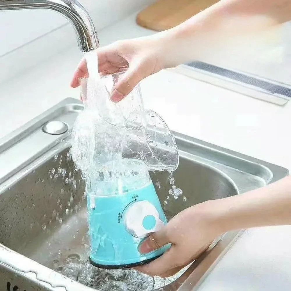 Multi-Drum Vegetable Cutting, Slicing & Shredding Tool in blue, manual kitchen chopper being cleaned under running water in a sink, showcasing its easy-to-clean design for vegetable prep maintenance